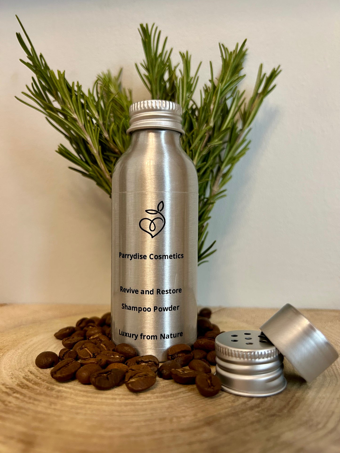 Caffeine and rosemary shampoo powder in aluminium bottle